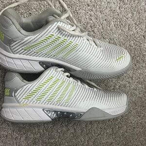White and Gray Athletic Sneakers with Green Accents